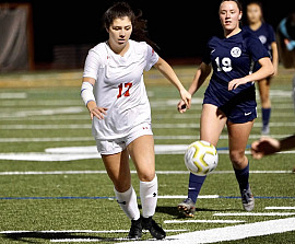 Lexi Zandonella chases down a ball on the soccer field