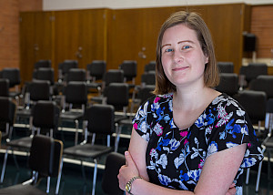 Paige Wallace '13 stands in the Music Room where she made memories as a student.