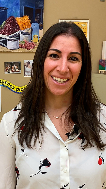 Karina Thor smiles in her spanish classroom