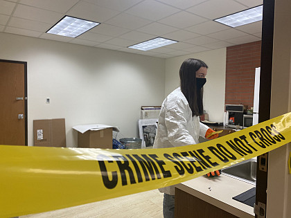 Students look for clues during this collaborative, hands-on forensic science lab.