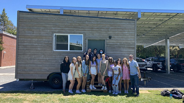 Student engineers with the finished Tiny House