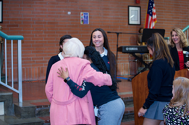Dobrich 004 Naomi Dobrich hugs a student who receives scholarship assistance at the Scholarship Banquet in April 2019.